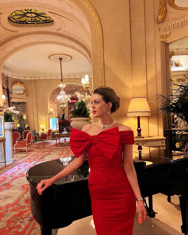 Luxury red off-the-shoulder evening dress with a dramatic oversized bow, tailored for a perfect fit.