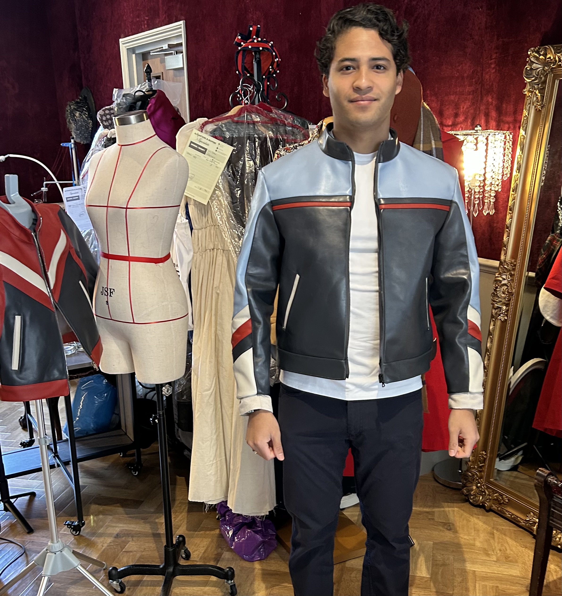 Client wearing a colour-blocked bespoke leather jacket in the Pimlico atelier