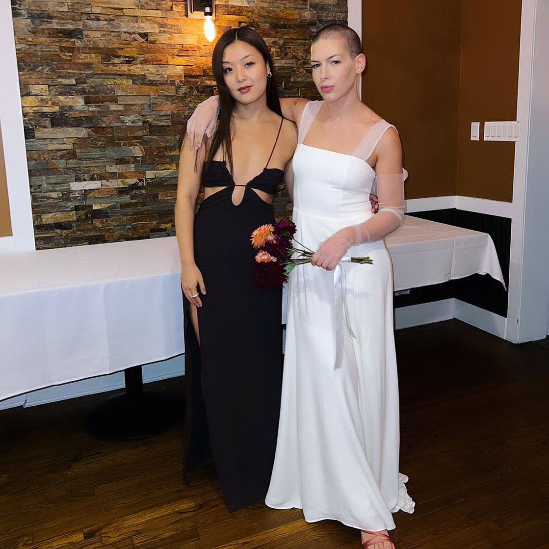 Modern square-neck wedding dress with sheer sleeves beside a black evening gown