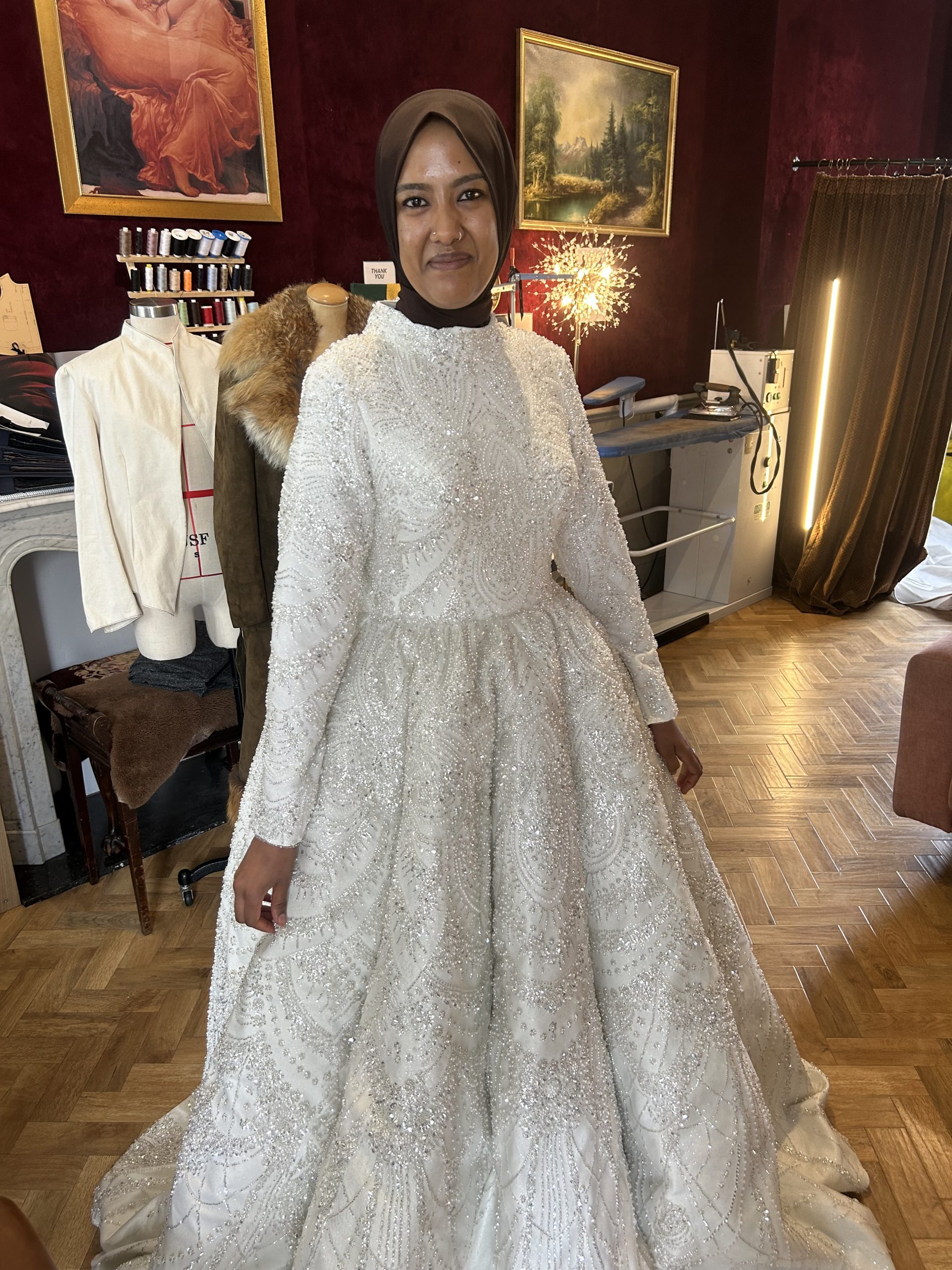 Fully beaded high-neck long-sleeve wedding dress fitted in the Altbes Pimlico atelier