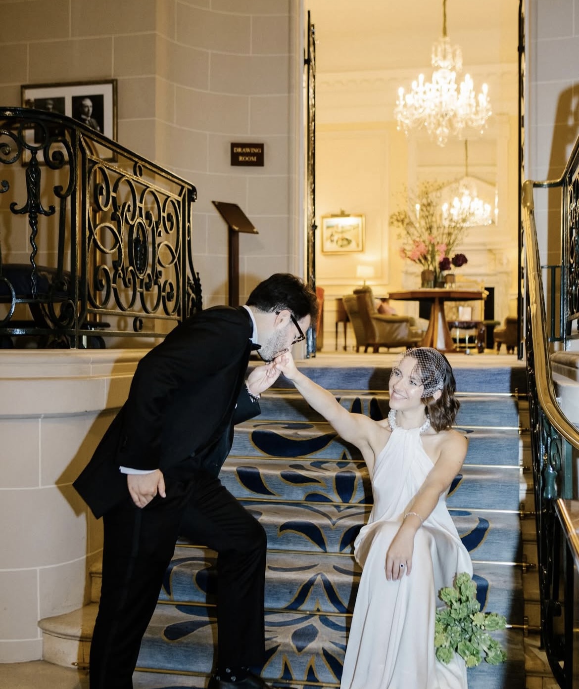 Bespoke white halter-neck silk gown and classic tuxedo worn for a luxury special occasion.