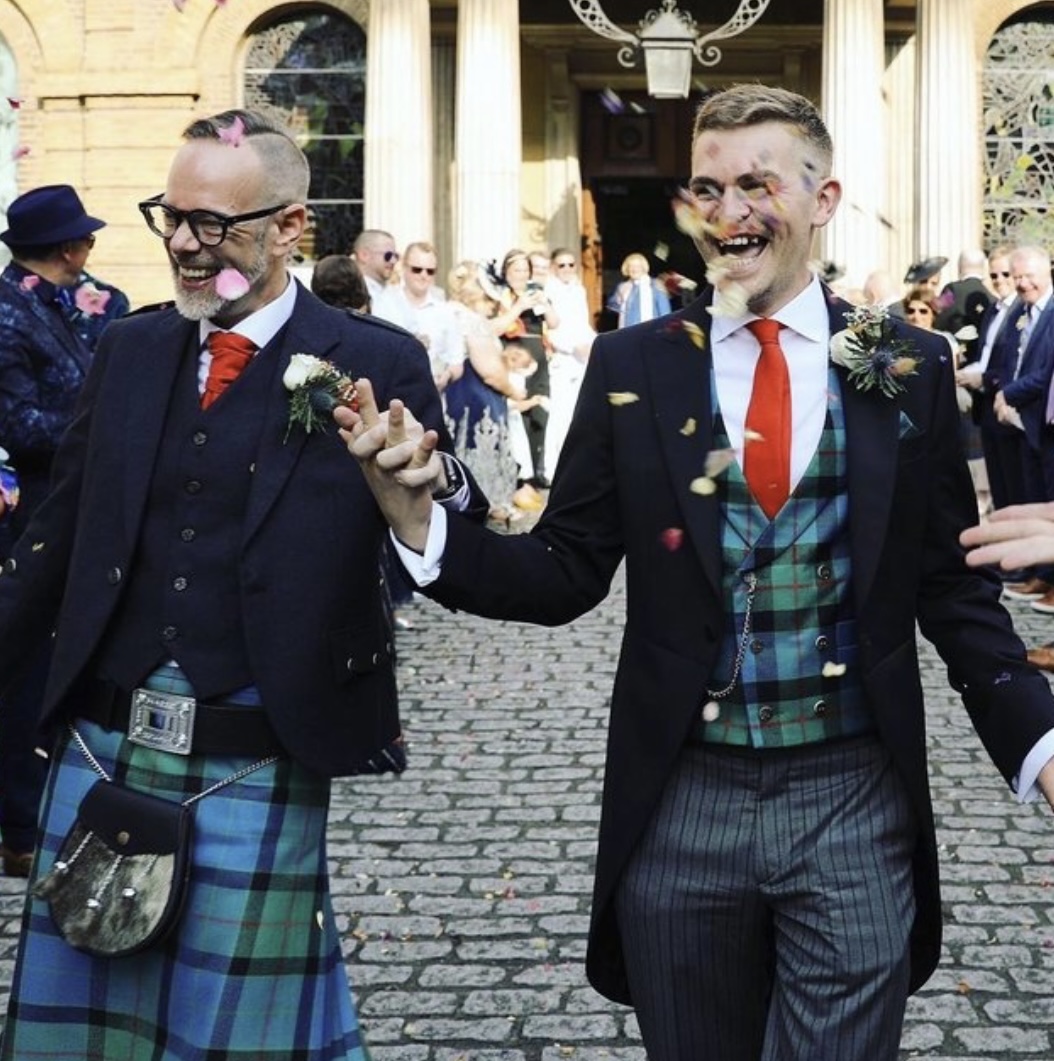 Wedding couple in a bespoke Scottish navy jacket with tartan kilt and matching morning suit tailcoat